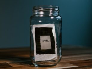 clear glass jar on brown wooden table