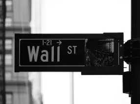 grayscale photo of Wall St. signage