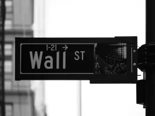 grayscale photo of Wall St. signage